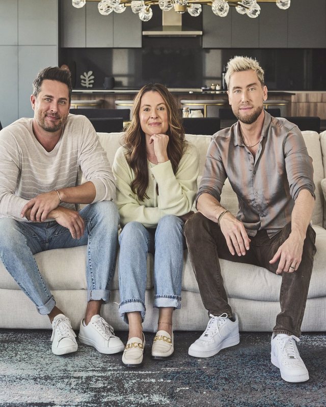 Three team members sitting together on a couch